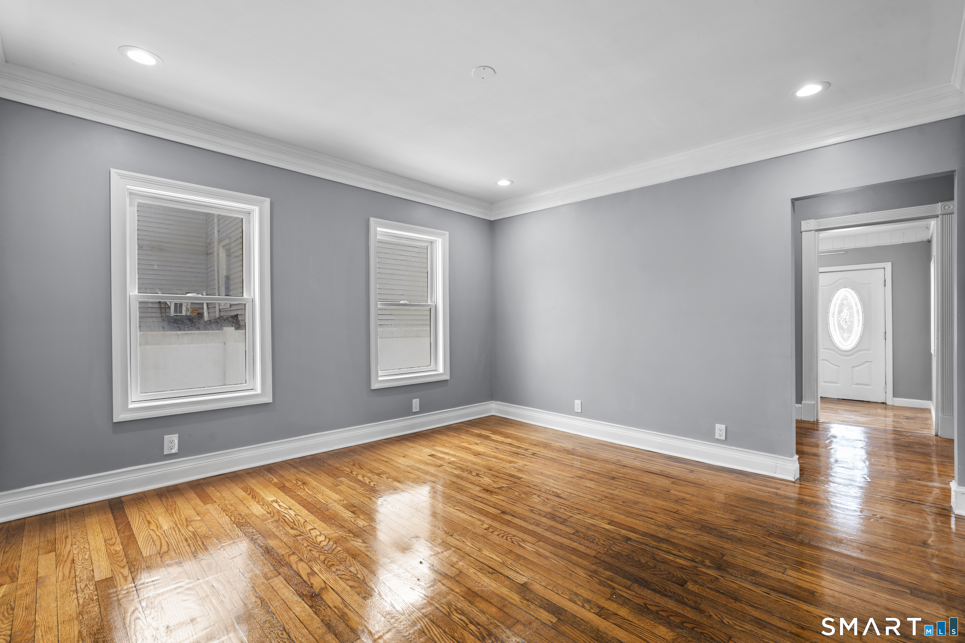 171 Foster Street Meriden, CT 06451 - Photo 17 of 35 a view of empty room with wooden floor and fan