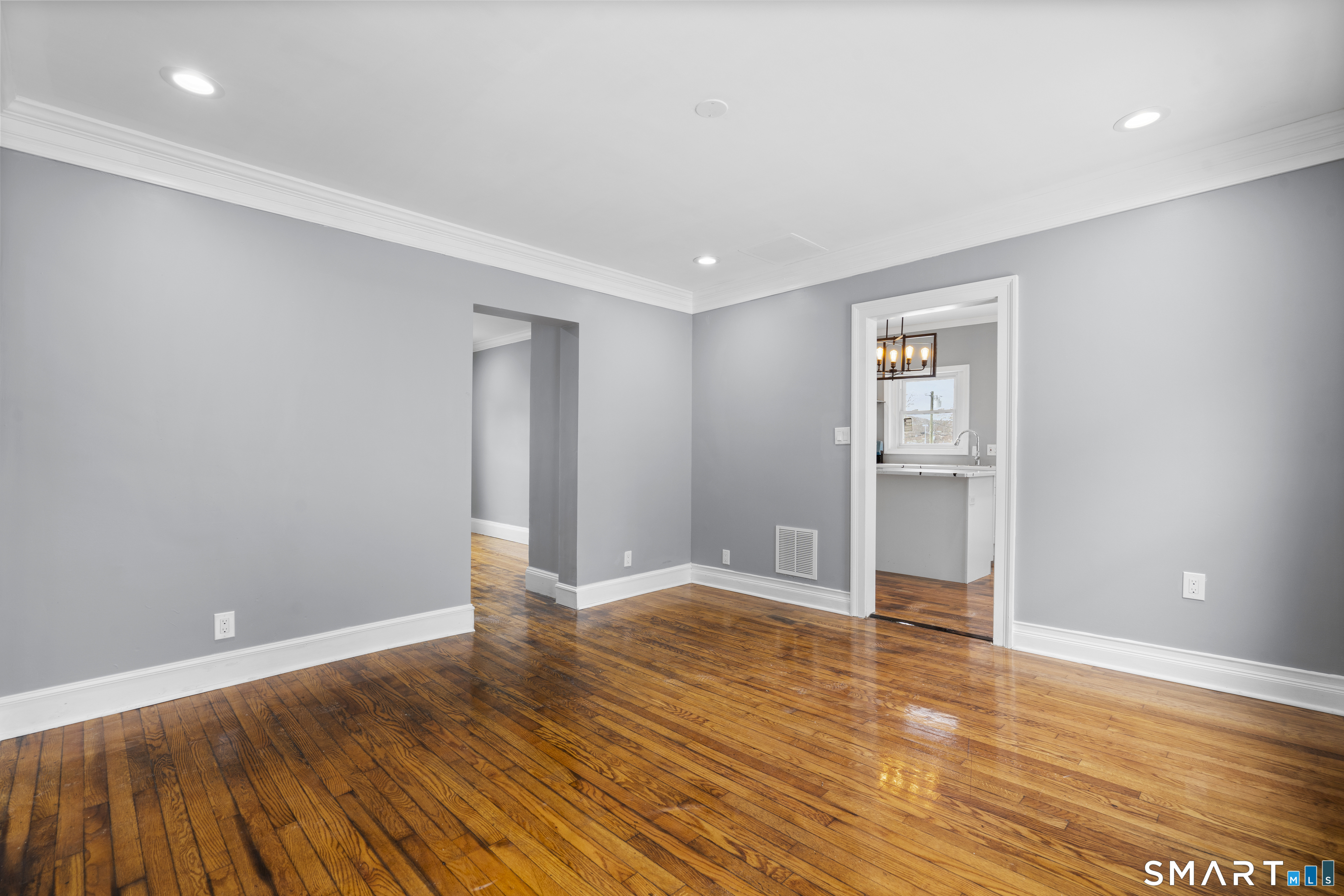 171 Foster Street Meriden, CT 06451 - Photo 18 of 35 a view of an empty room with wooden floor and closet