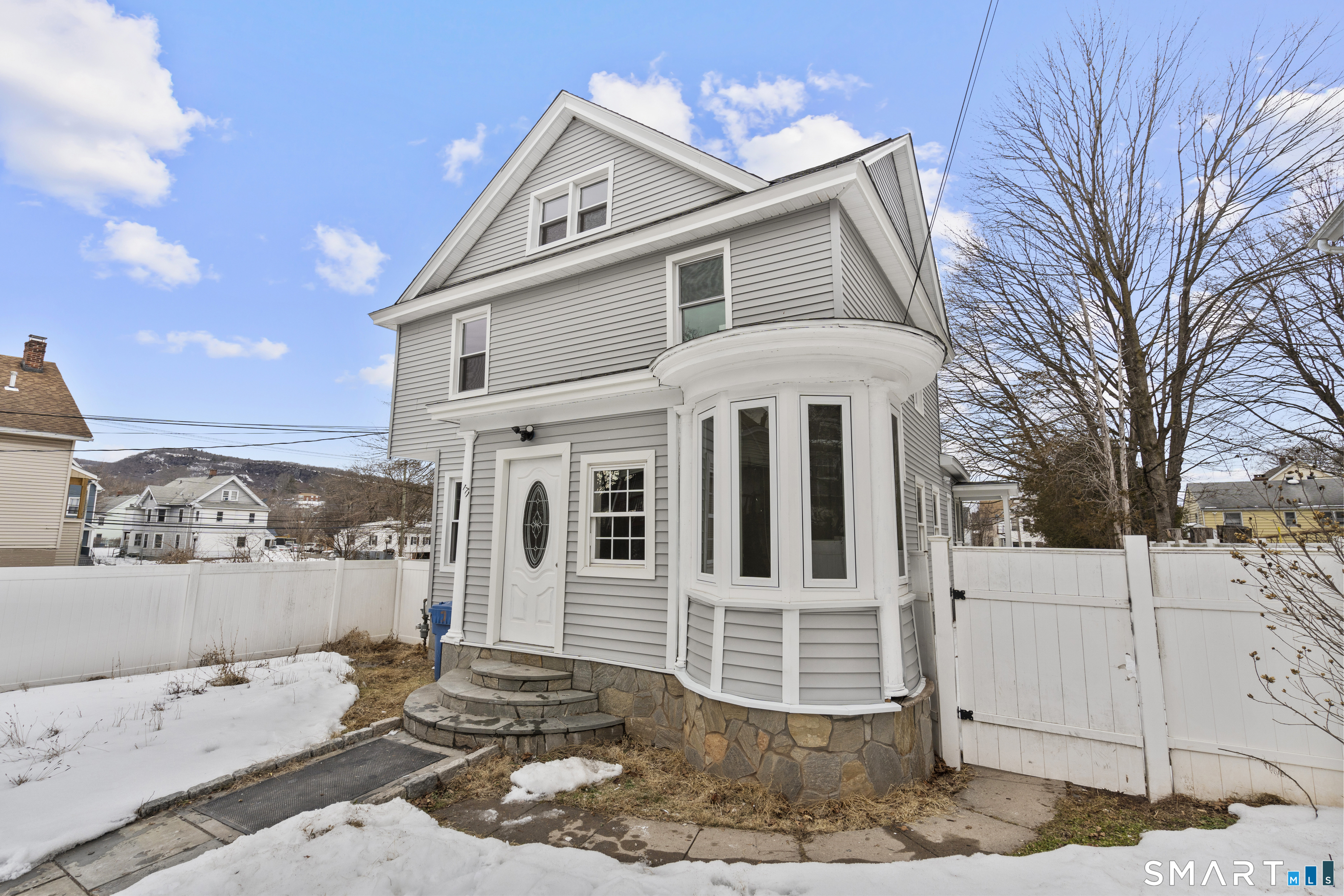 171 Foster Street Meriden, CT 06451 - Photo 2 of 35 a view of a white house with a large tree