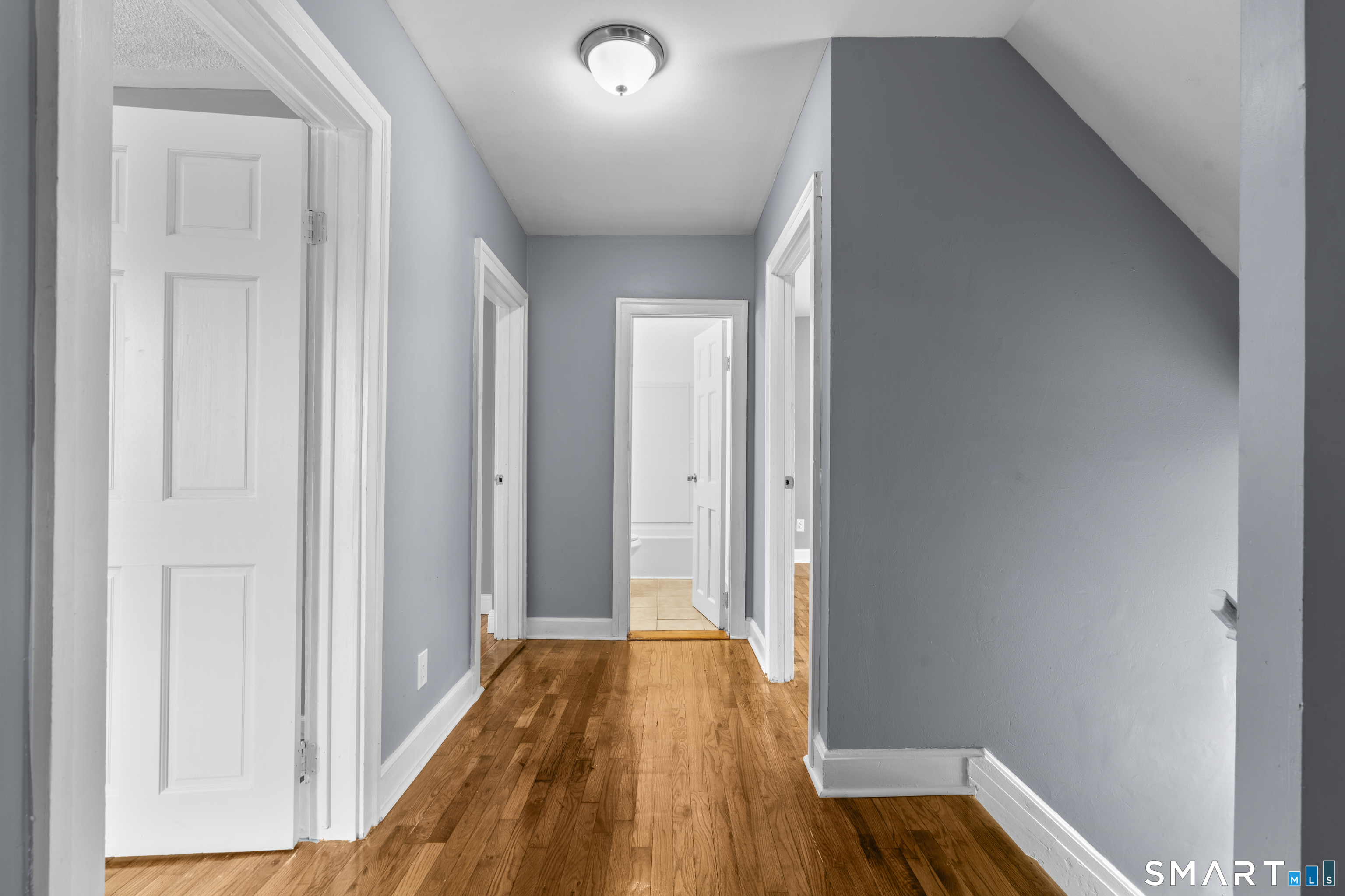 171 Foster Street Meriden, CT 06451 - Photo 21 of 35 a view of a room with wooden floor and a bathroom