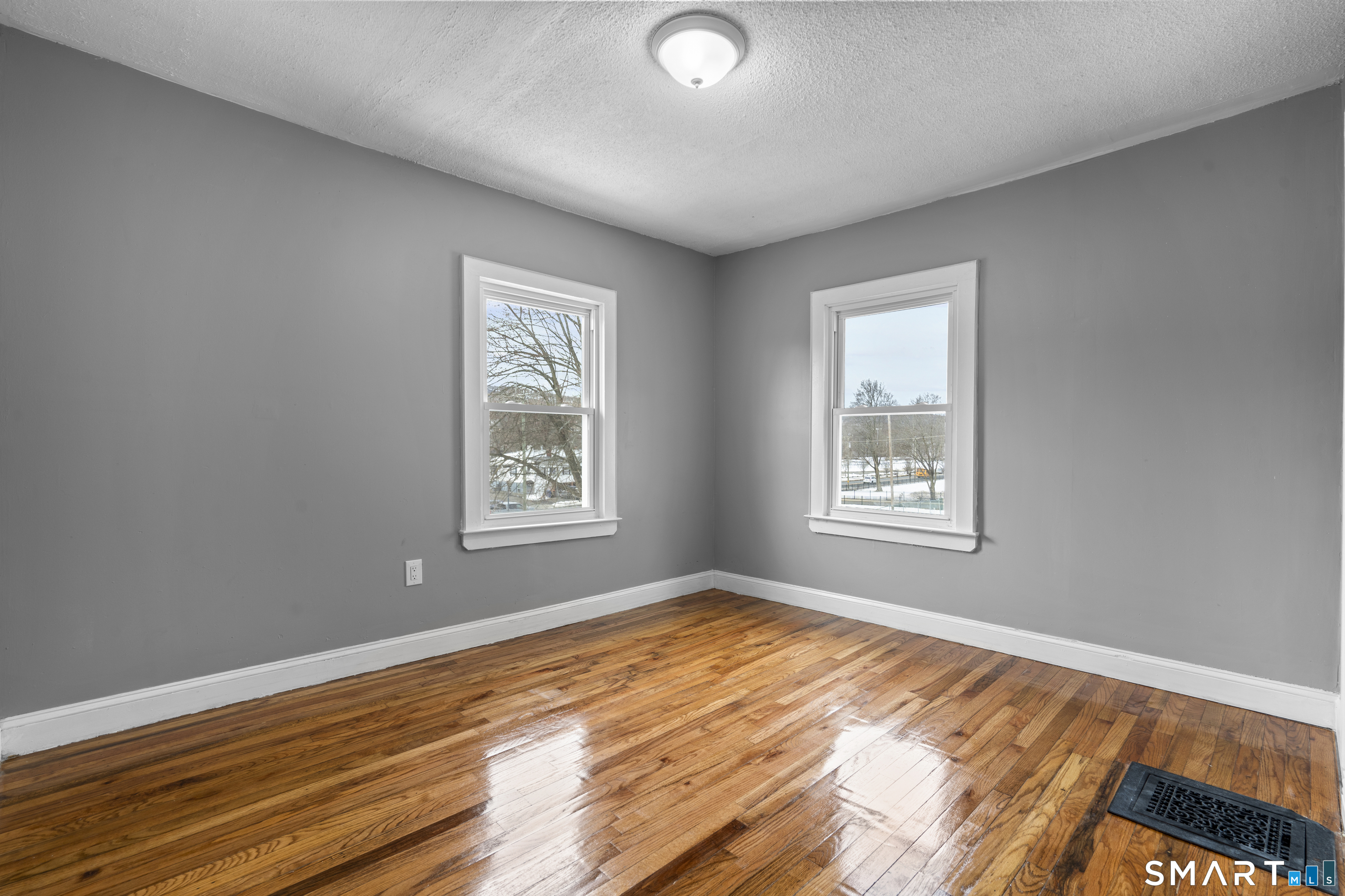 171 Foster Street Meriden, CT 06451 - Photo 25 of 35 a view of an empty room with wooden floor and a window