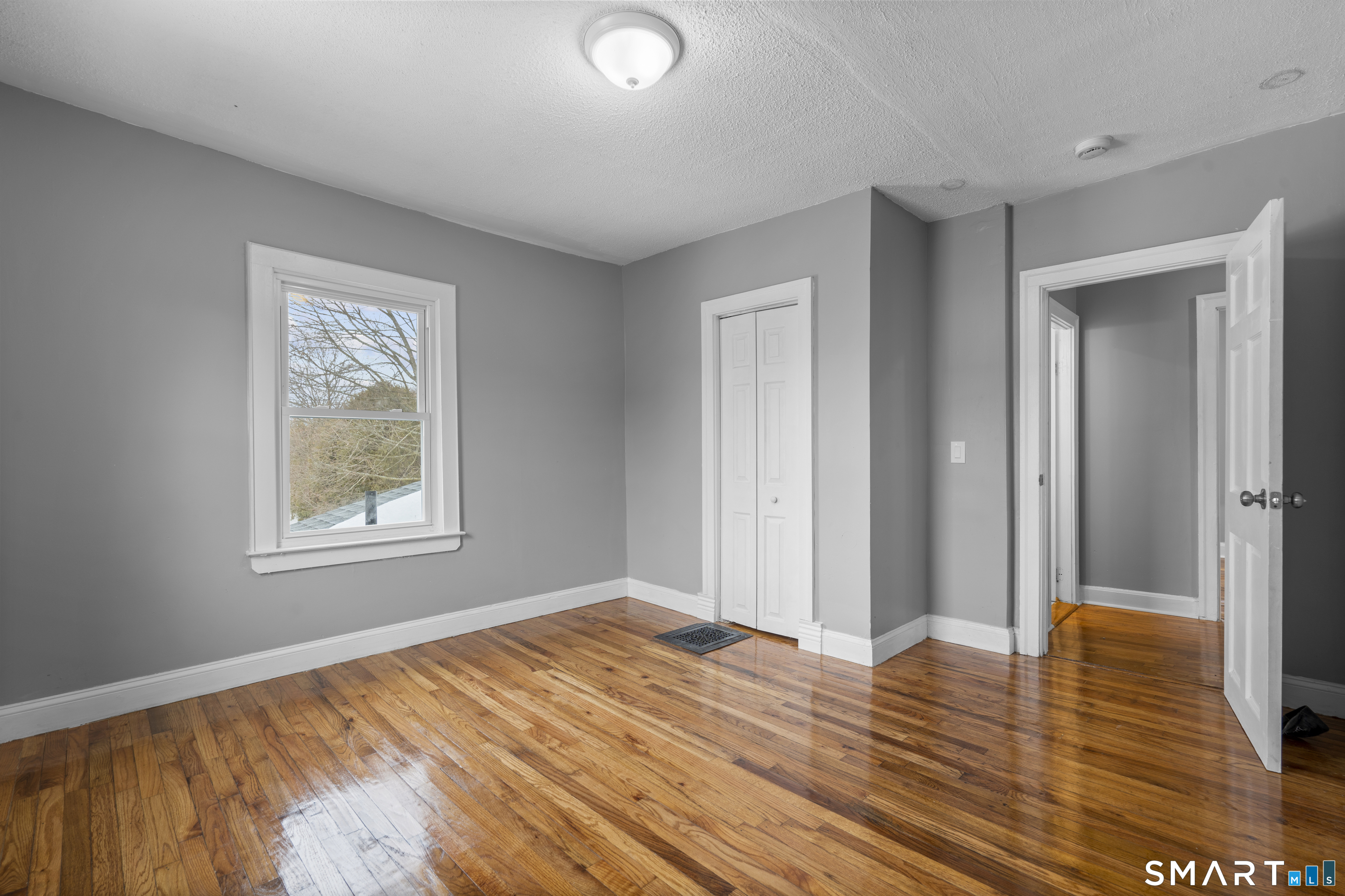 171 Foster Street Meriden, CT 06451 - Photo 26 of 35 a view of a livingroom with wooden floor and window