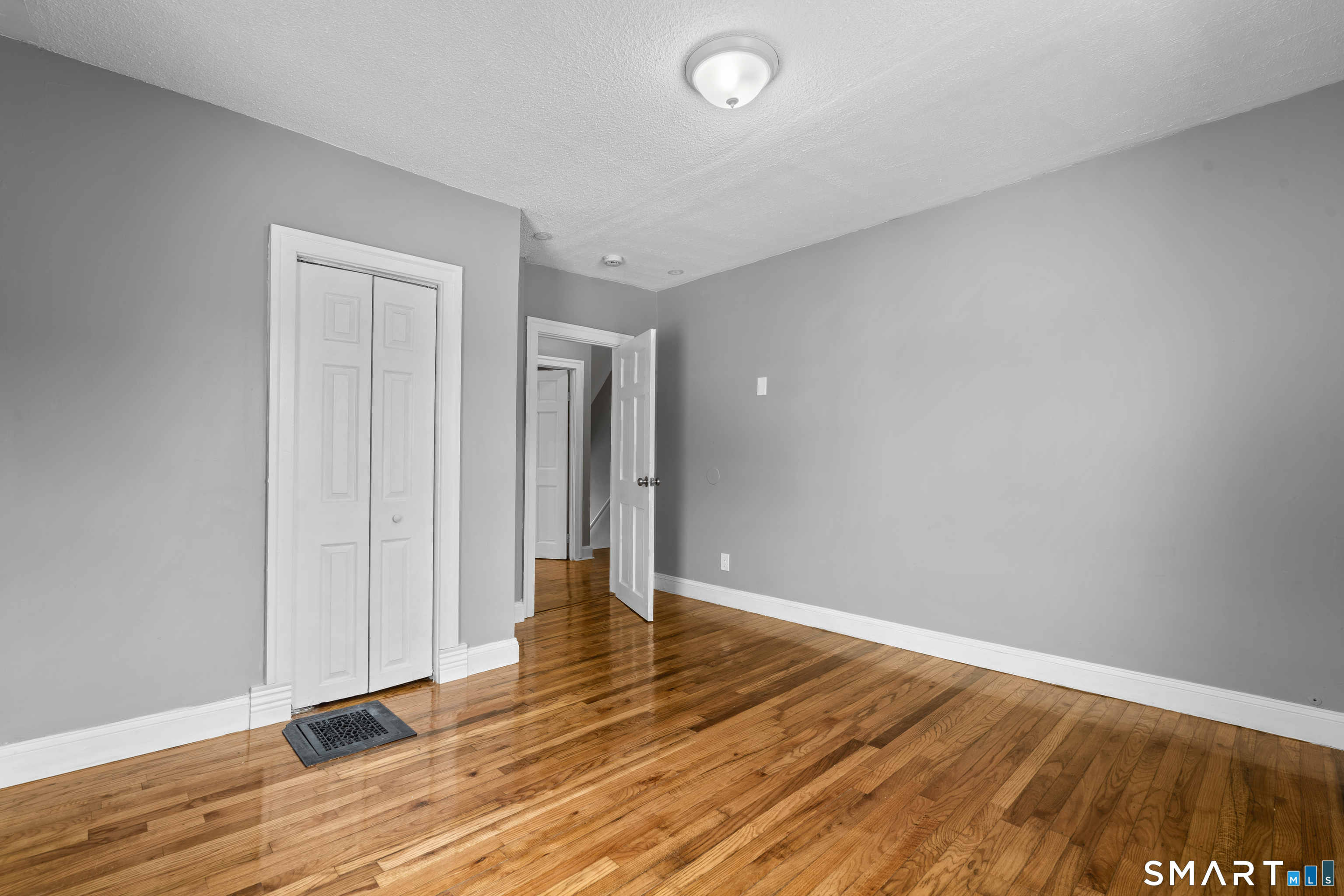 171 Foster Street Meriden, CT 06451 - Photo 27 of 35 a view of an empty room and wooden floor