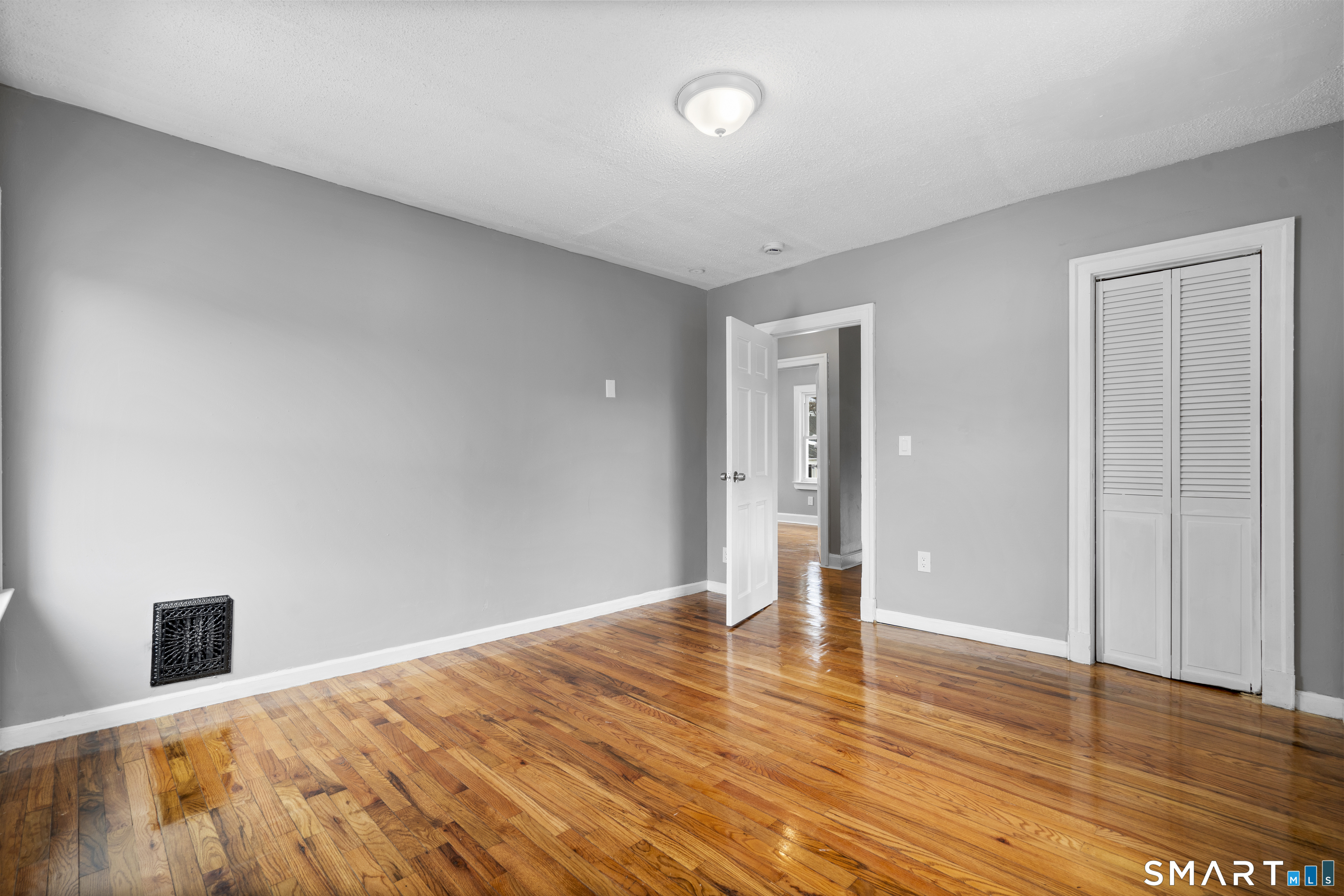 171 Foster Street Meriden, CT 06451 - Photo 29 of 35 a view of empty room with wooden floor