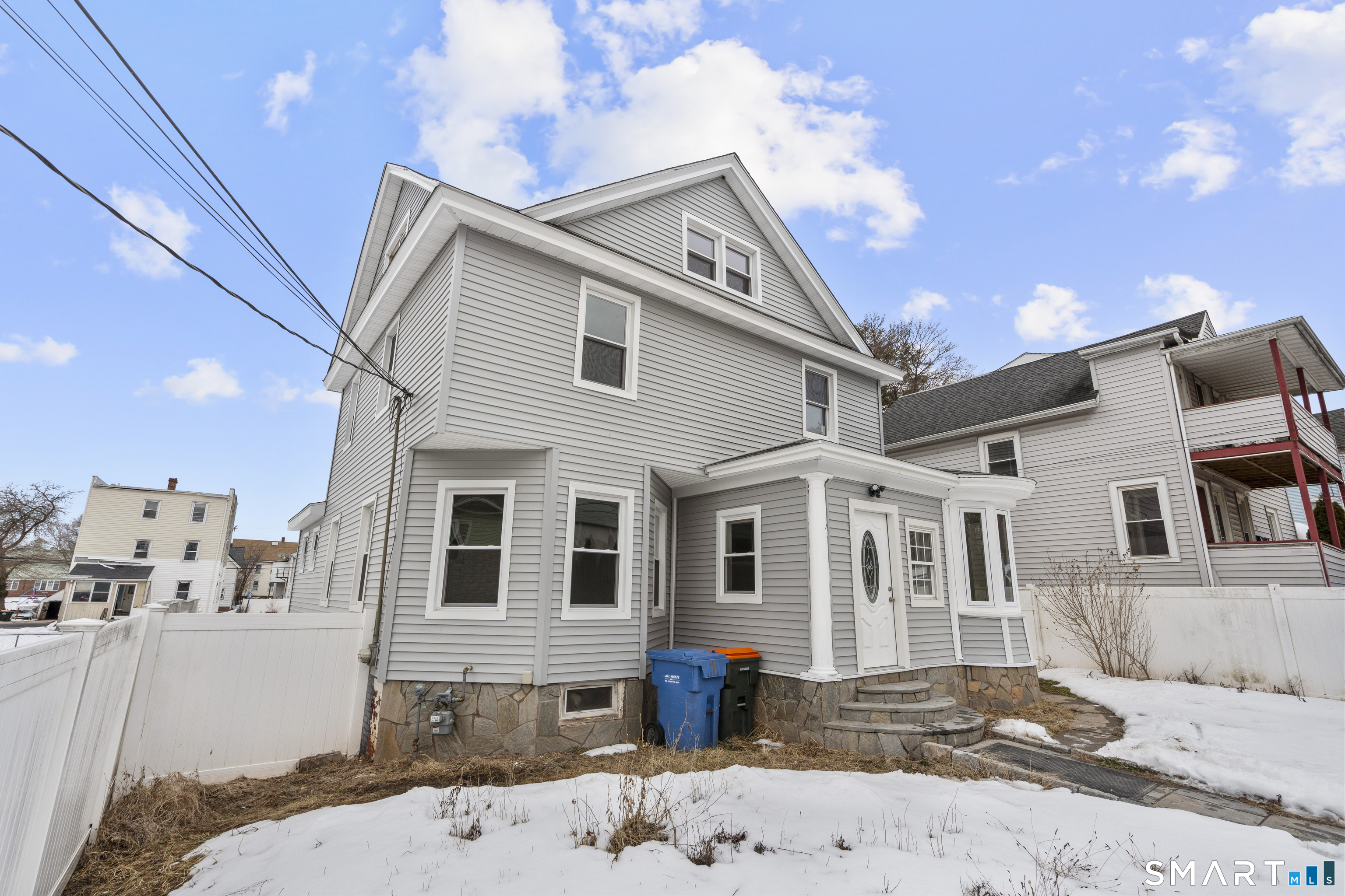 171 Foster Street Meriden, CT 06451 - Photo 3 of 35 a view of a white house with a large tree