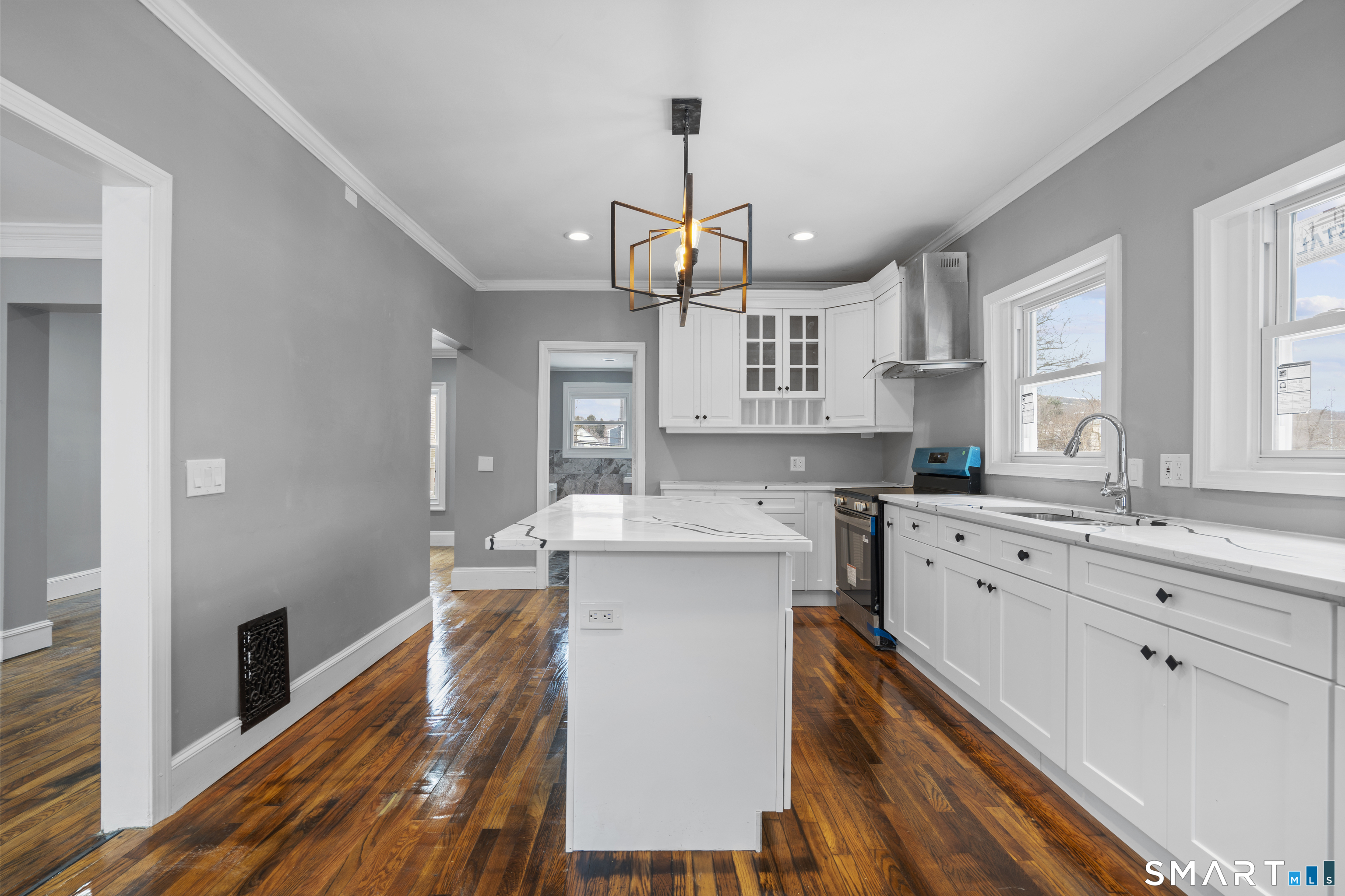 171 Foster Street Meriden, CT 06451 - Photo 7 of 35 a kitchen with kitchen island granite countertop a sink cabinets a counter top space and stainless steel appliances