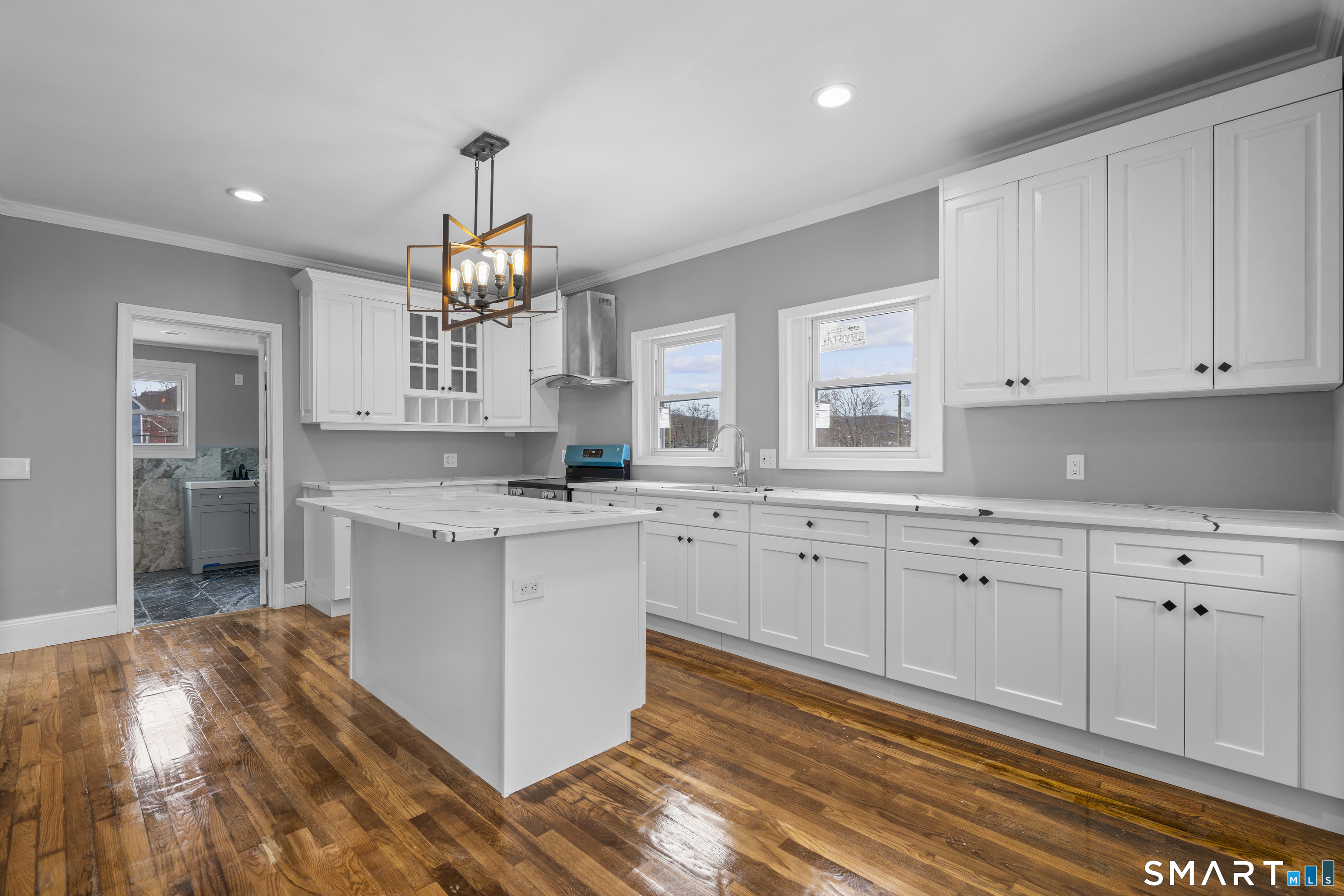 171 Foster Street Meriden, CT 06451 - Photo 8 of 35 a kitchen with white cabinets and sink