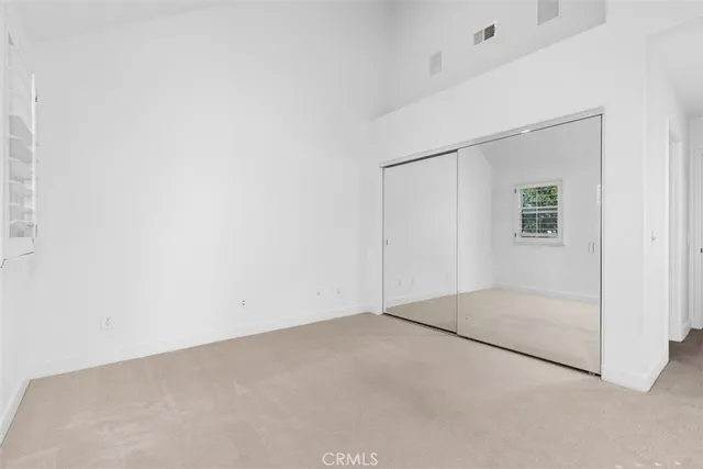 a bathroom with a granite countertop sink a toilet and a bathtub