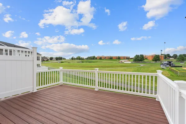 a view of a balcony with wooden floor