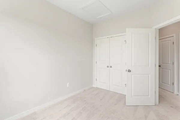 a view of an entryway with wooden floor and stairs