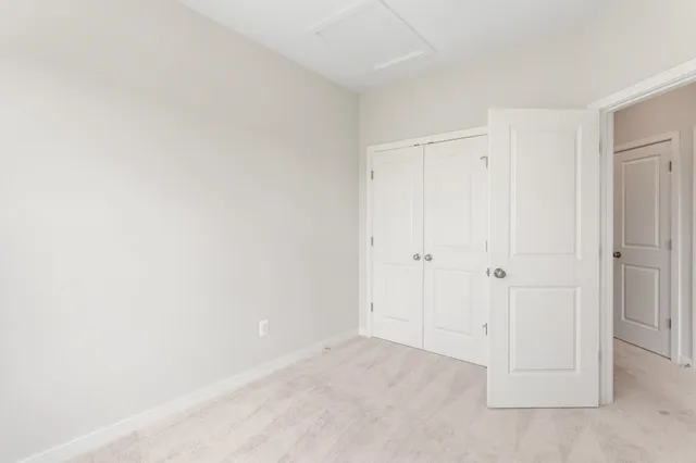 a view of an entryway with wooden floor and stairs