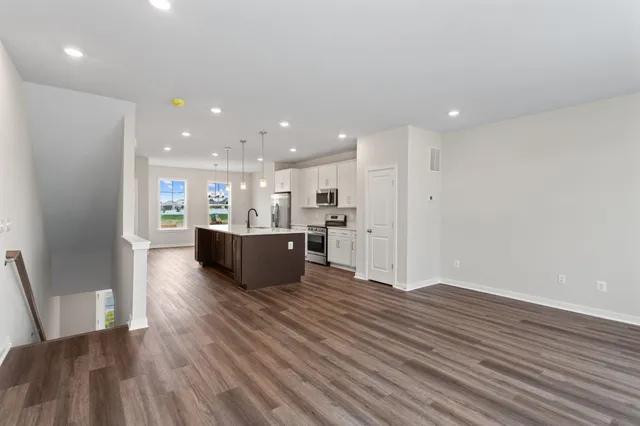 a view of kitchen with wooden floor and window