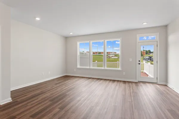 a kitchen with stainless steel appliances granite countertop a sink a stove and a refrigerator