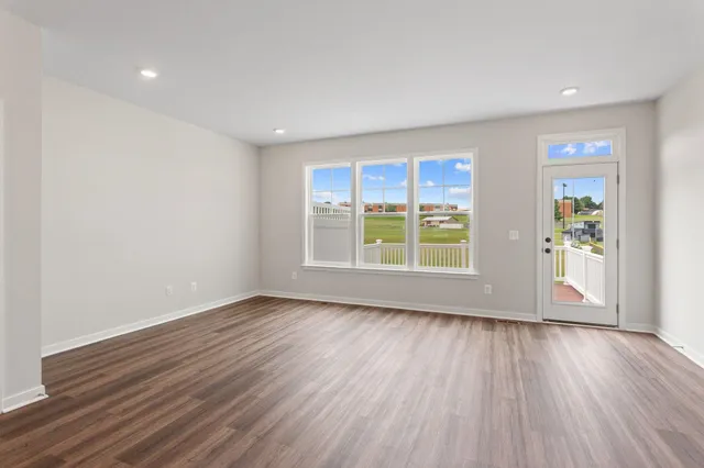 a kitchen with stainless steel appliances granite countertop a sink a stove and a refrigerator