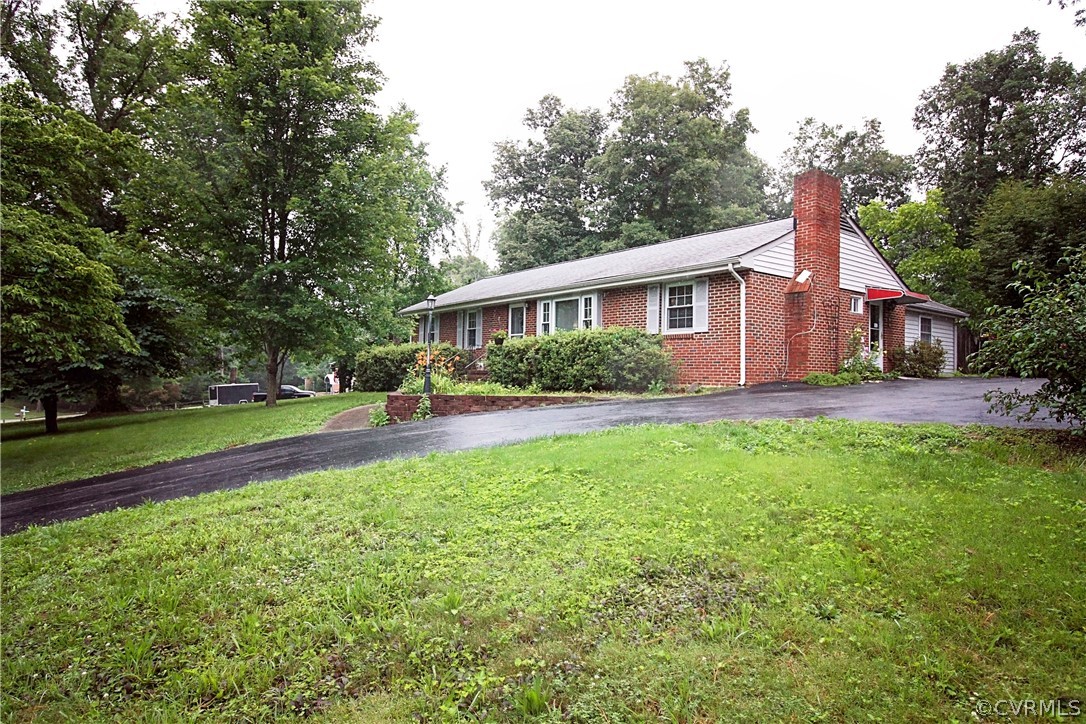 143 Heppel Road North Chesterfield, VA 23236 - Photo 3 of 18 a front view of house with yard and green space