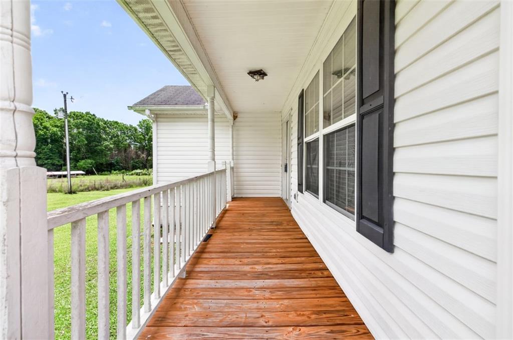 602 Pendergrass Road Winder, GA 30680 - Photo 7 of 44 a view of balcony with wooden floor and fence