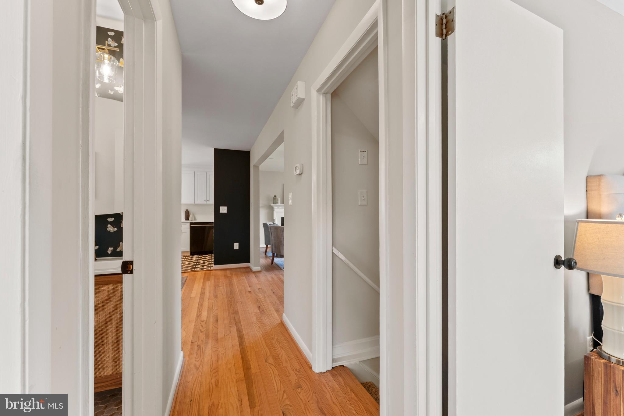 3 Melbourne Avenue Silver Spring, MD 20901 - Photo 21 of 80 a view of a hallway with wooden floor and staircase