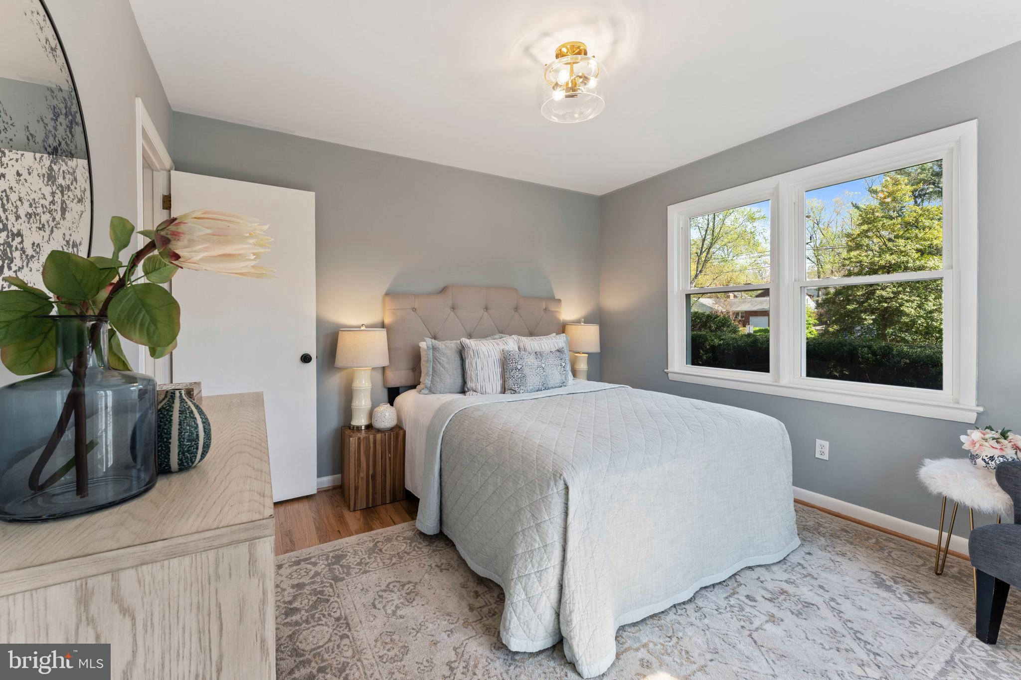 3 Melbourne Avenue Silver Spring, MD 20901 - Photo 27 of 80 a bedroom with a bed and a potted plant
