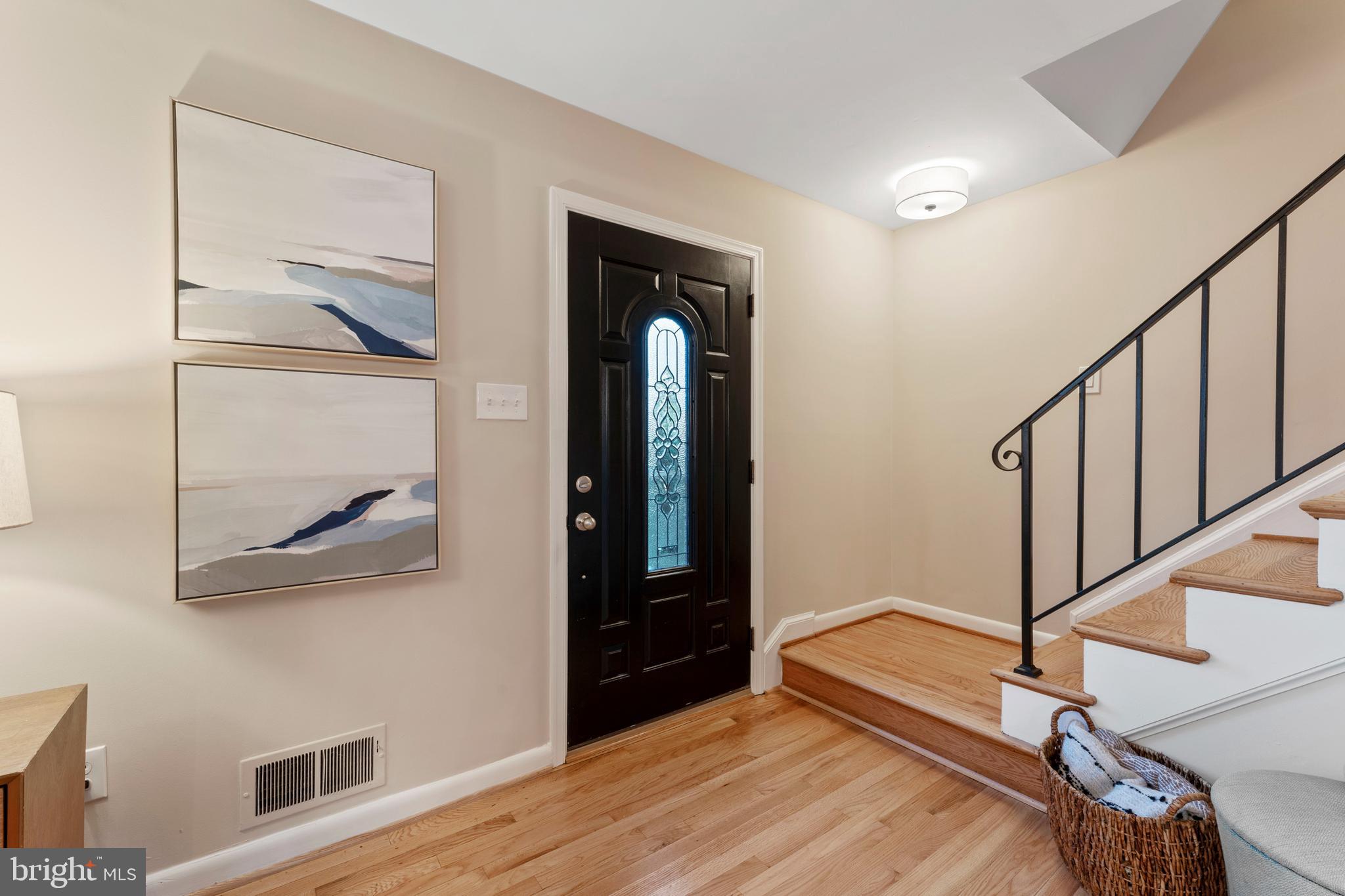 3 Melbourne Avenue Silver Spring, MD 20901 - Photo 3 of 80 a view of a hallway with wooden floor and staircase