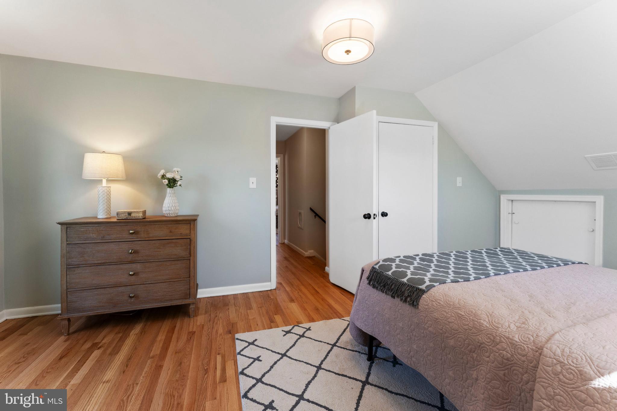 3 Melbourne Avenue Silver Spring, MD 20901 - Photo 43 of 80 a bedroom with a bed and wooden floor