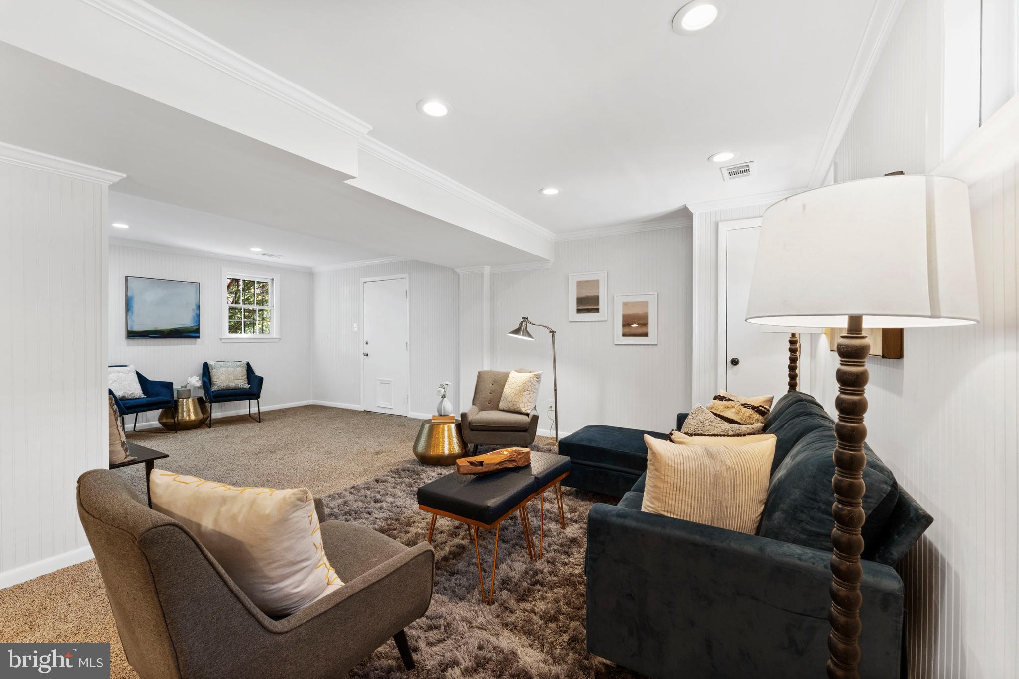 3 Melbourne Avenue Silver Spring, MD 20901 - Photo 55 of 80 a living room with furniture and a flat screen tv