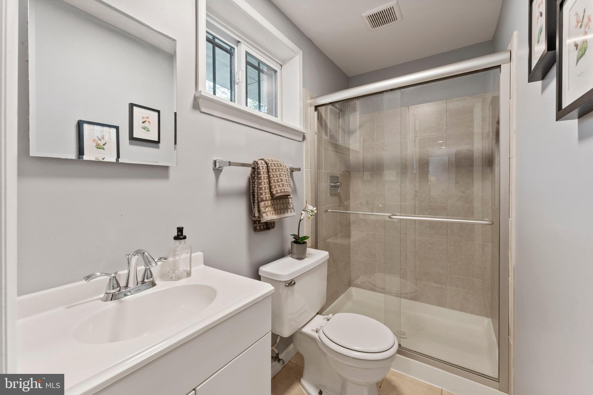 3 Melbourne Avenue Silver Spring, MD 20901 - Photo 56 of 80 a bathroom with a sink a toilet and shower