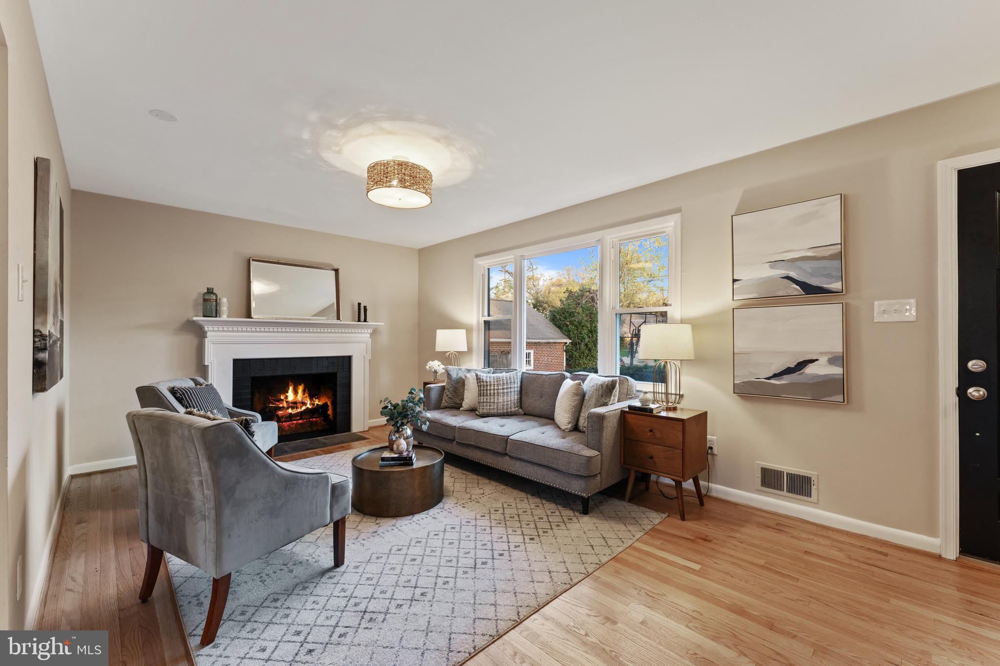 3 Melbourne Avenue Silver Spring, MD 20901 - Photo 7 of 80 a living room with furniture and a fireplace
