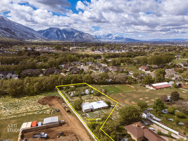2672 East Canyon Road Springville, UT 84663 - Photo 3 of 33 Aerial view of residential area featuring property parcel outlined and mountains