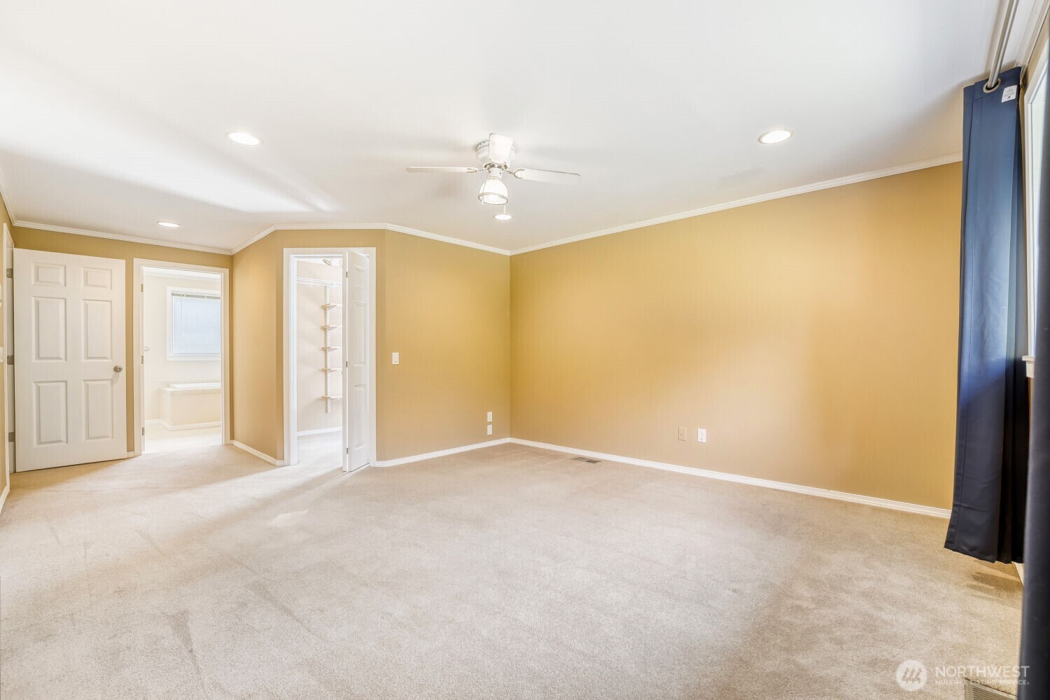 20115 48th Avenue Southeast Bothell, WA 98012 - Photo 11 of 26 an empty room with closet and a chandelier fan