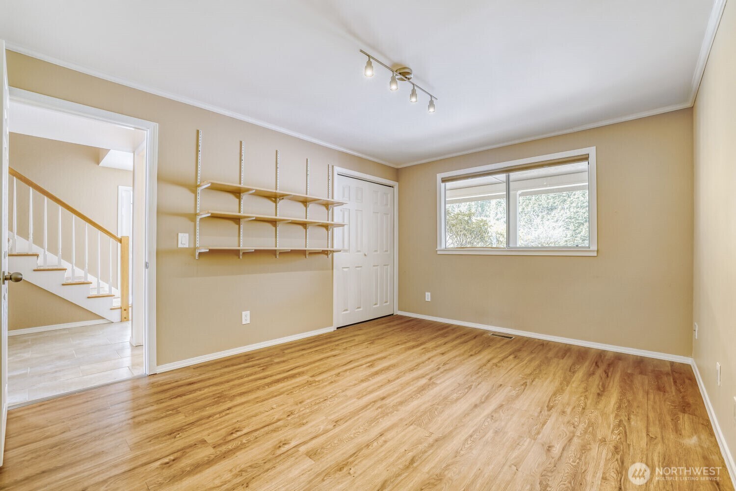 20115 48th Avenue Southeast Bothell, WA 98012 - Photo 12 of 26 a view of an empty room with wooden floor and a window