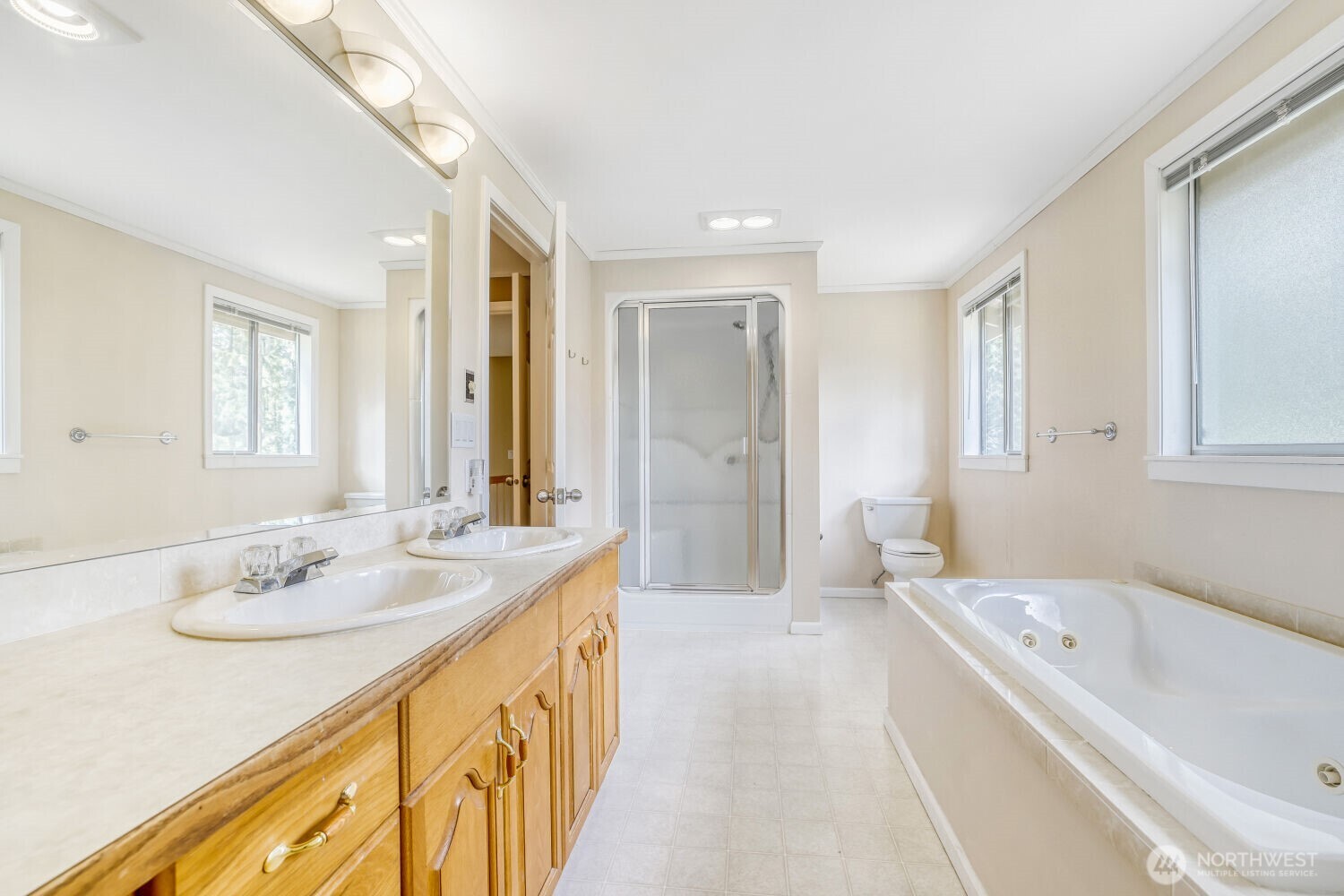 20115 48th Avenue Southeast Bothell, WA 98012 - Photo 13 of 26 a spacious bathroom with a tub sink and mirror