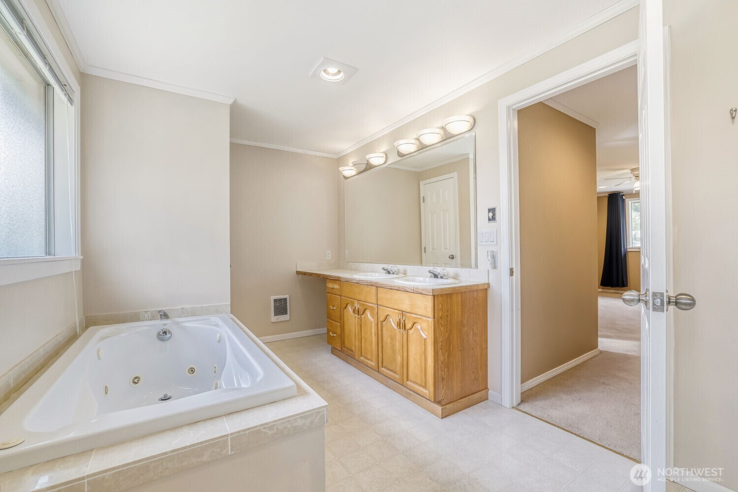 20115 48th Avenue Southeast Bothell, WA 98012 - Photo 14 of 26 a bathroom with a tub sink and mirror