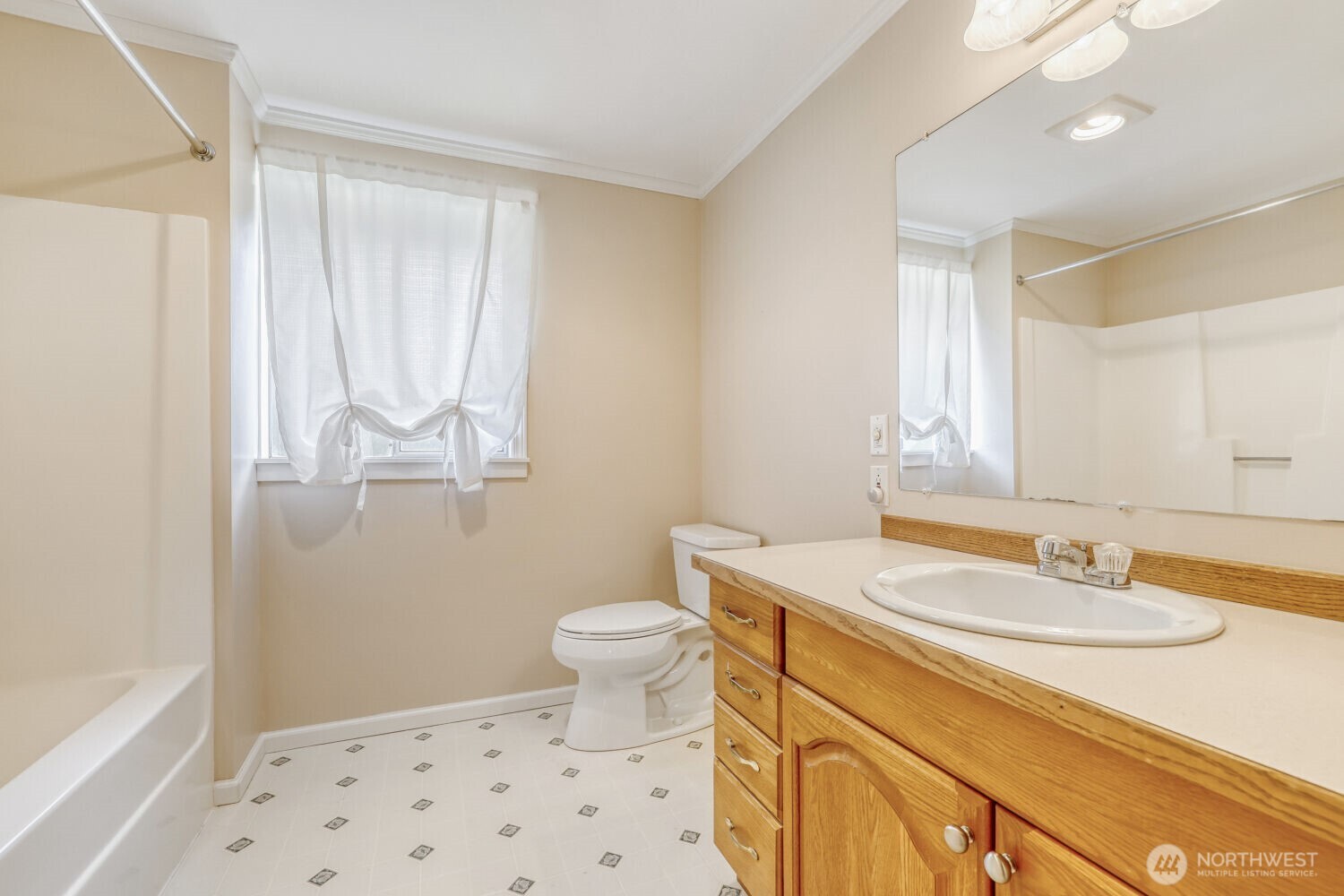 20115 48th Avenue Southeast Bothell, WA 98012 - Photo 20 of 26 a bathroom with a sink a toilet and a mirror