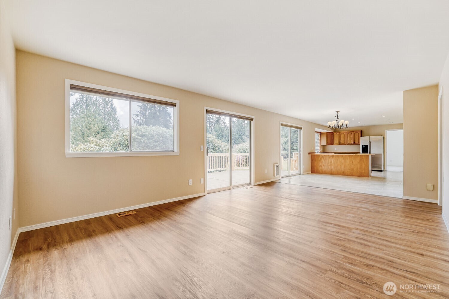 20115 48th Avenue Southeast Bothell, WA 98012 - Photo 5 of 26 a view of an empty room with a window and wooden floor