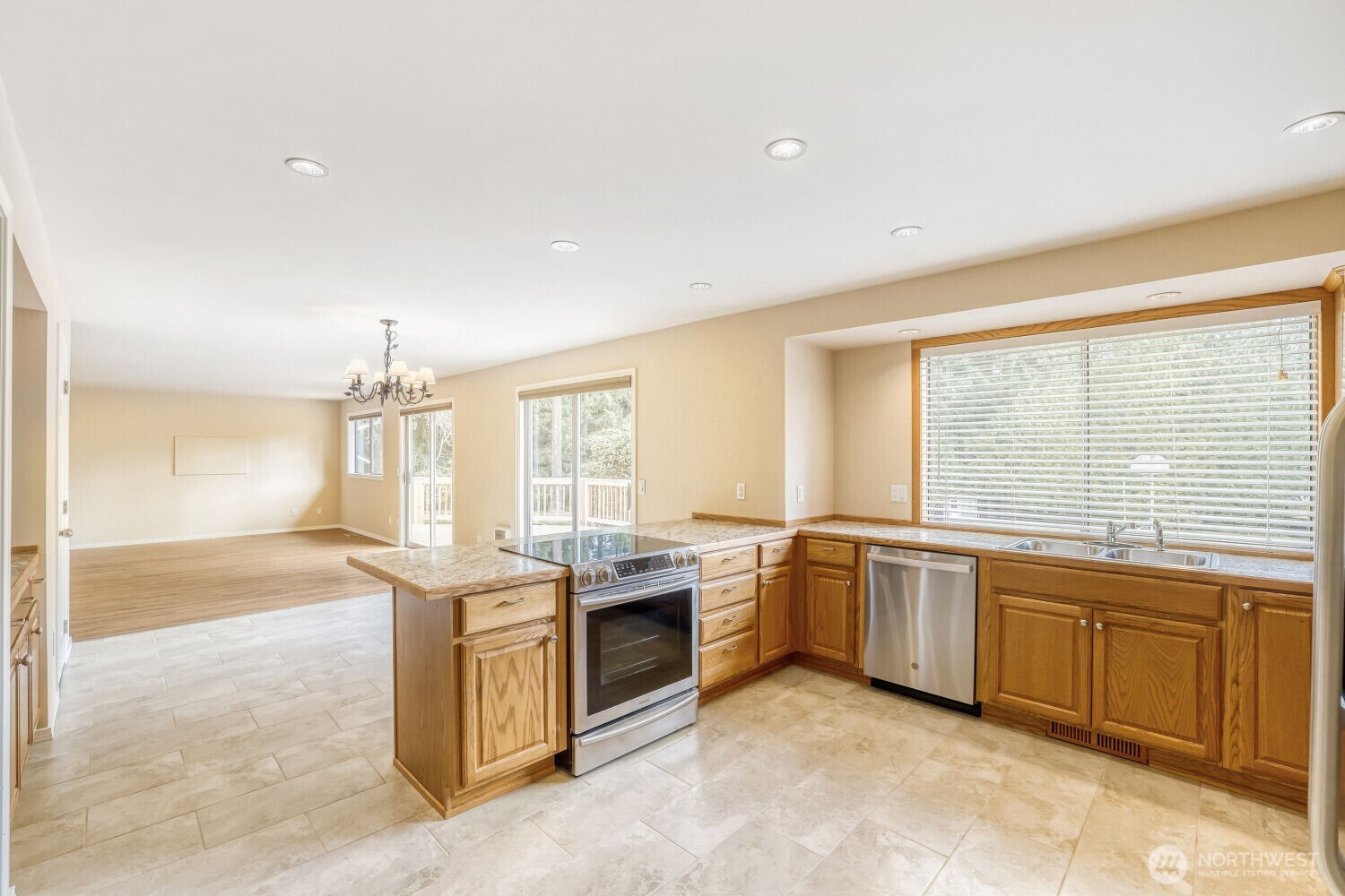 20115 48th Avenue Southeast Bothell, WA 98012 - Photo 8 of 26 a kitchen with stainless steel appliances granite countertop sink stove and cabinets