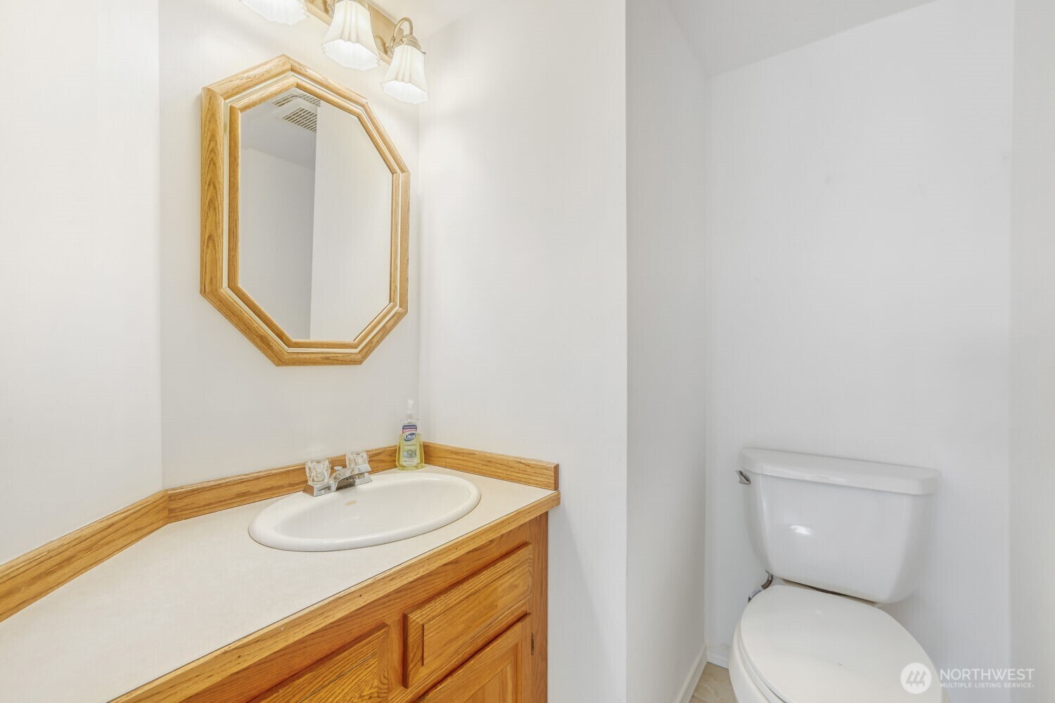 20115 48th Avenue Southeast Bothell, WA 98012 - Photo 9 of 26 a bathroom with a toilet sink and mirror