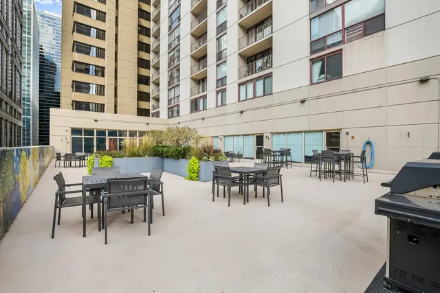a patio with a table and chairs