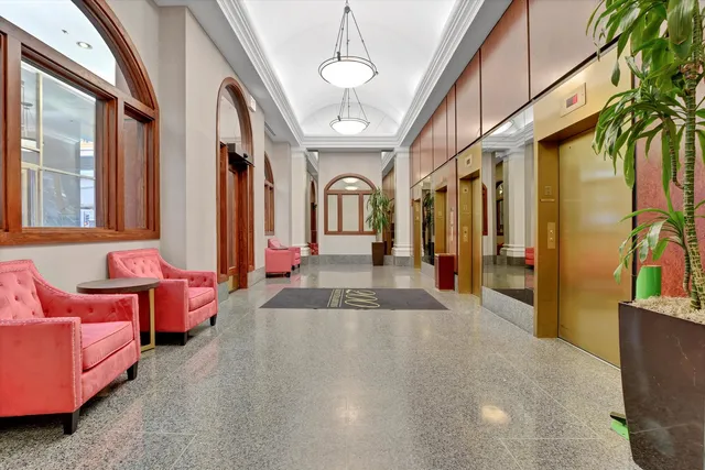 a lobby with furniture and window