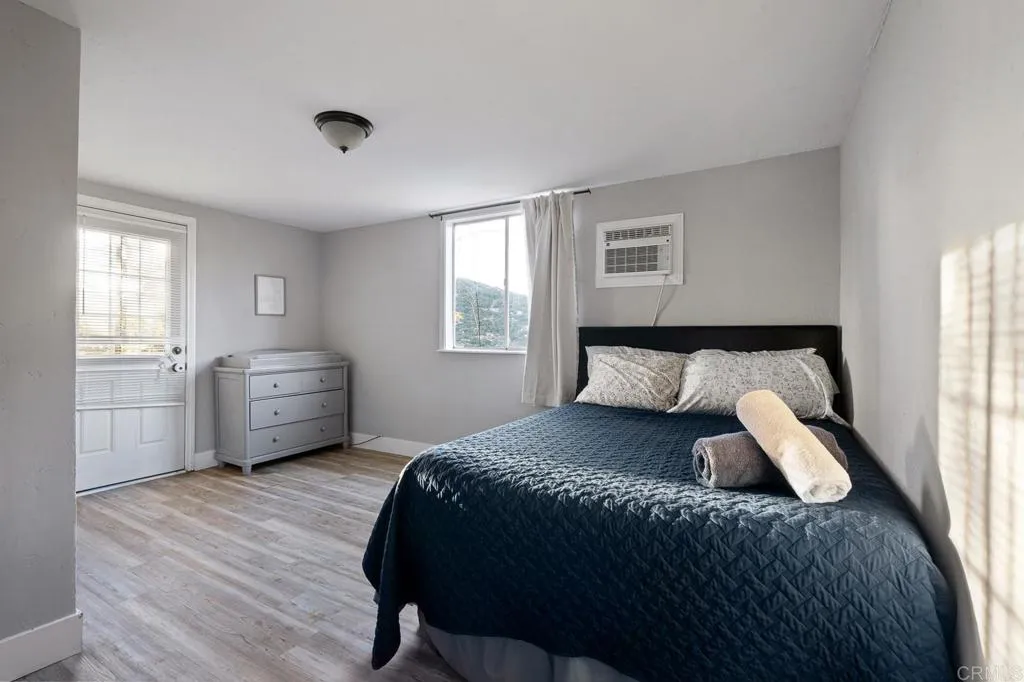 26086 Bear Valley Heights Road Valley Center, CA 92082 - Photo 61 of 65 a bedroom with a bed and a window