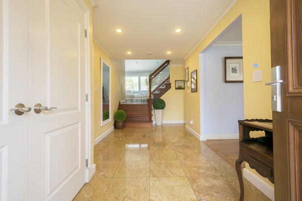 26 Cider Mill Road Framingham, MA 01701 - Photo 3 of 30 a view of a hallway with wooden floor and a bathroom