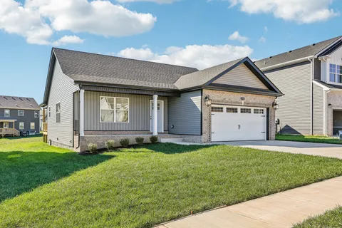 a front view of a house with a yard