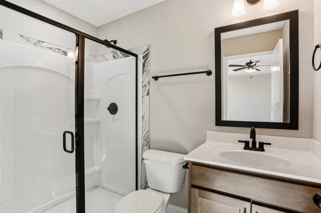 a bathroom with a glass shower door