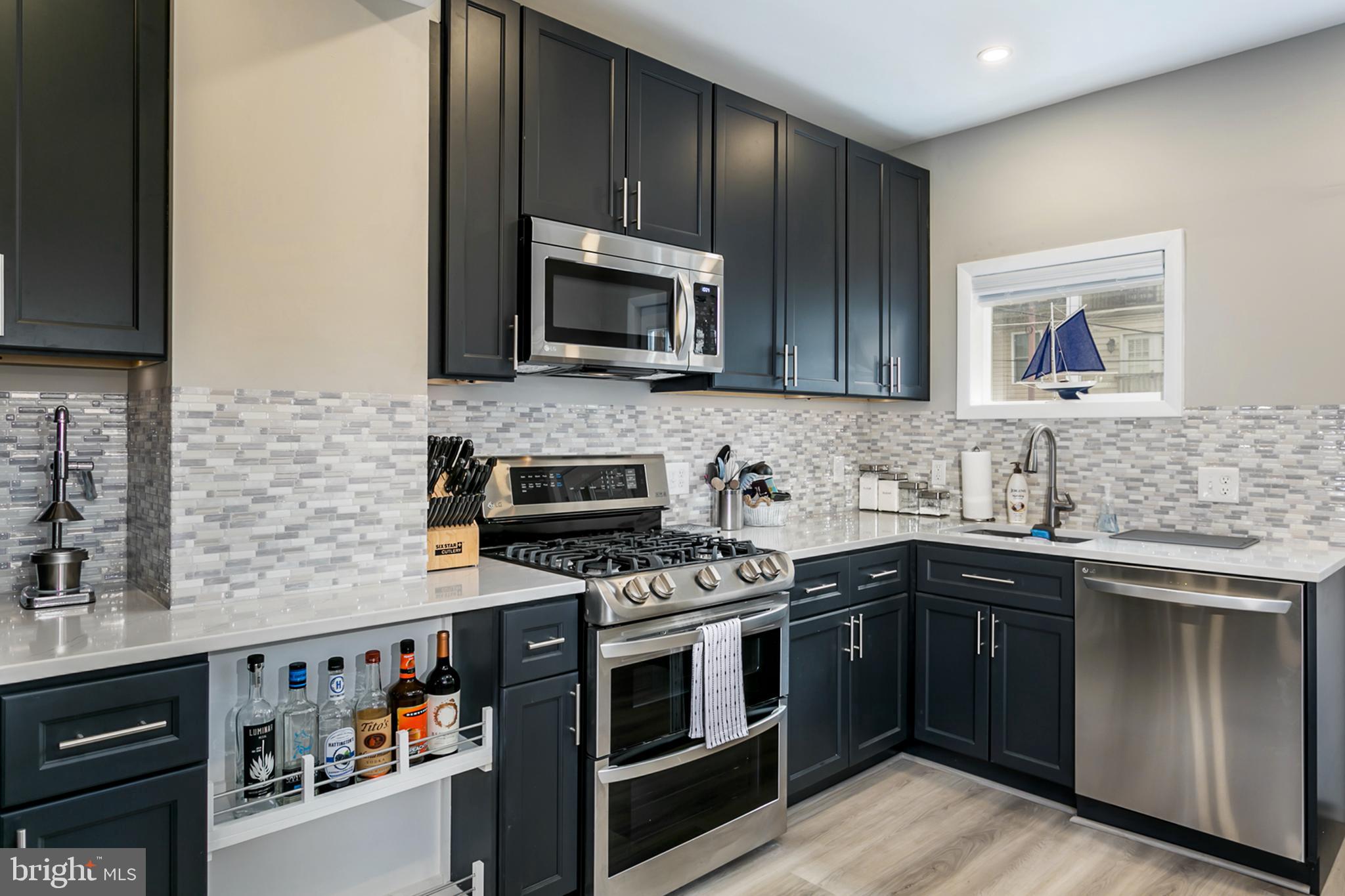 1325 Cooksie Street Baltimore, MD 21230 - Photo 7 of 19 Stylish backsplash really enhances the kitchen!