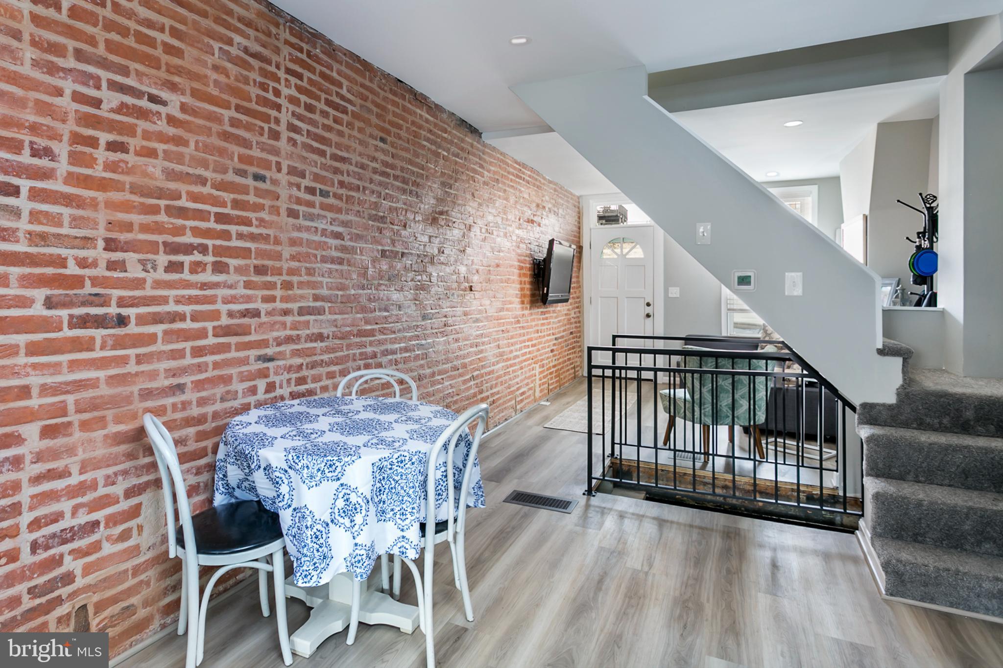 1325 Cooksie Street Baltimore, MD 21230 - Photo 9 of 19 Beautiful exposed brick throughout the main level!