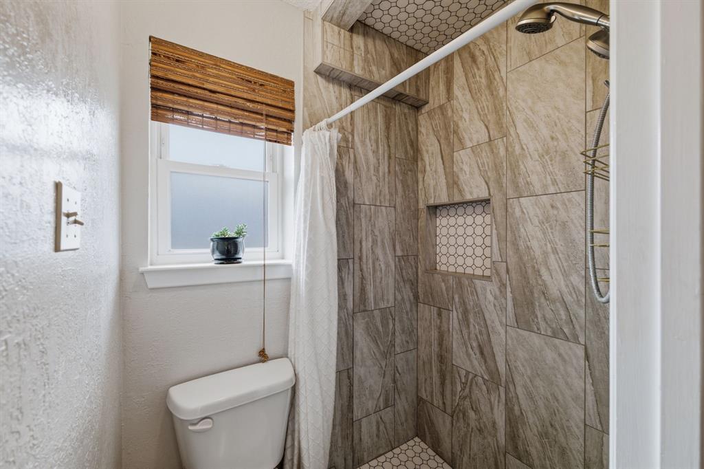 224 Overcrest Drive Benbrook, TX 76126 - Photo 21 of 39 a bathroom with a toilet and shower
