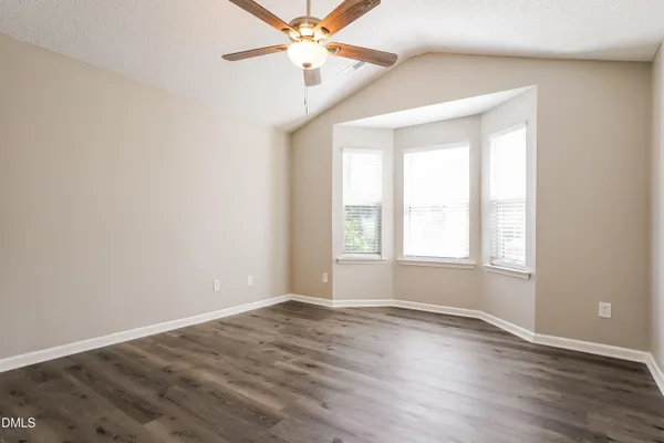 a kitchen with stainless steel appliances granite countertop a refrigerator a sink dishwasher a stove top oven a refrigerator with island and chairs