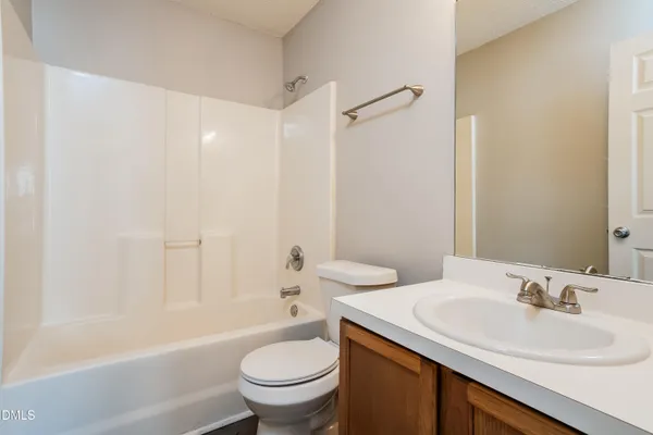 a view of wooden floor and windows in a room