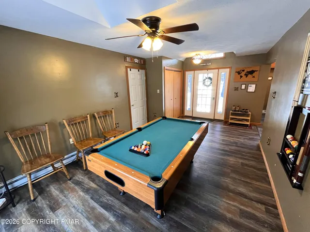 a living room with furniture fireplace and flat screen tv