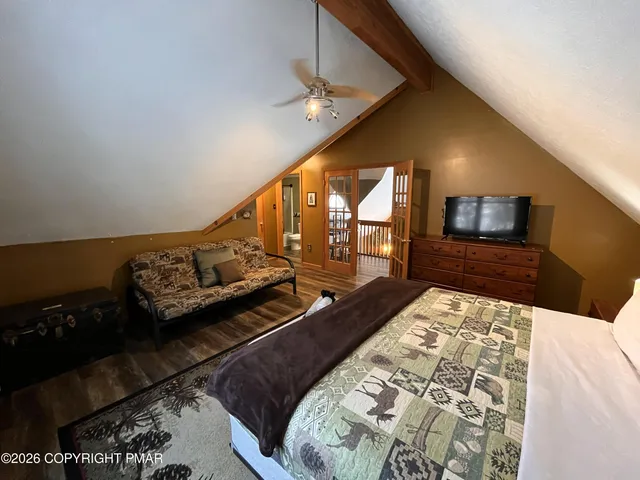 a room with pool table and windows