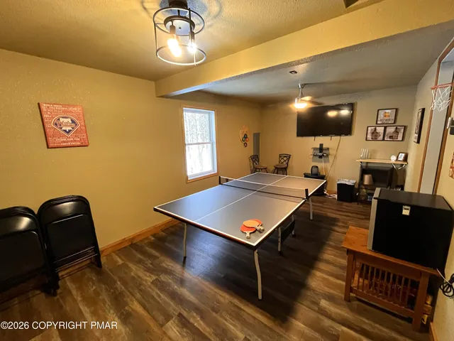 a living room with game table